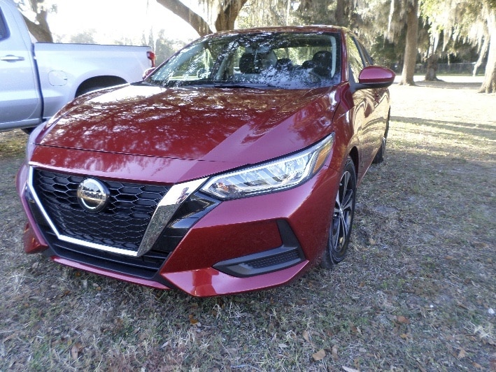 Front of red nissan sentra